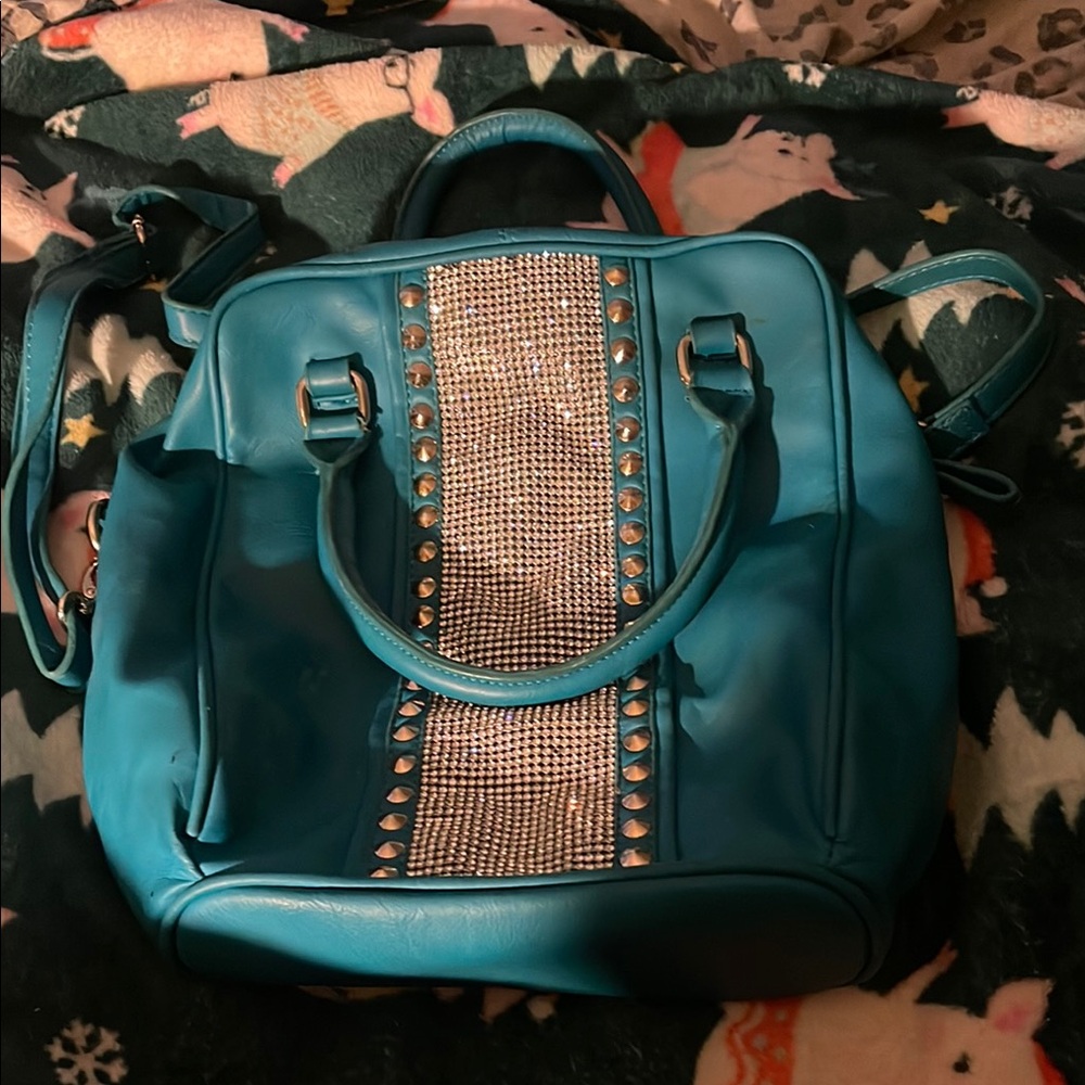 Charming Charlie Teal Backpack with Silver Accents